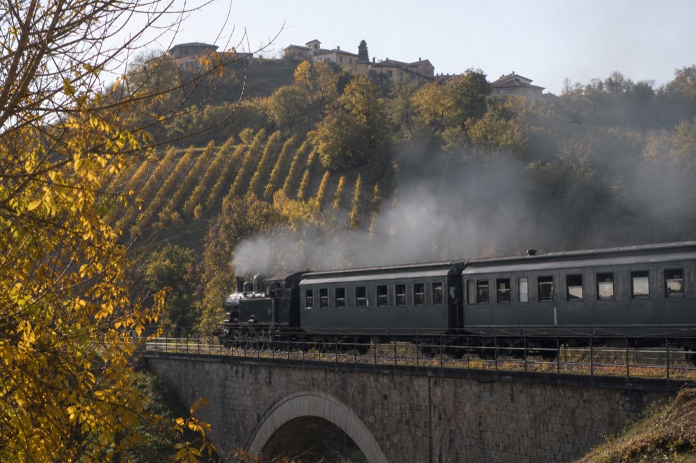 Historic train on a railway line through Piedmont hills.